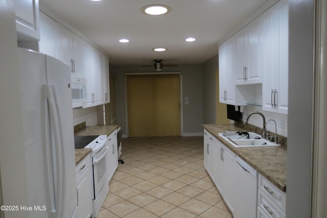 kitchen featuring a sink, white cabinetry, recessed lighting, white appliances, and light tile patterned floors