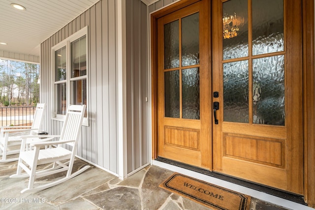 property entrance with french doors and covered porch