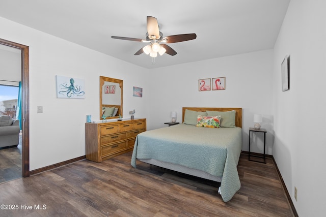 bedroom featuring dark wood-style floors, ceiling fan, and baseboards