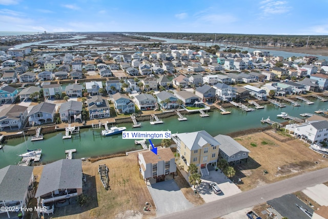 aerial view featuring a residential view and a water view