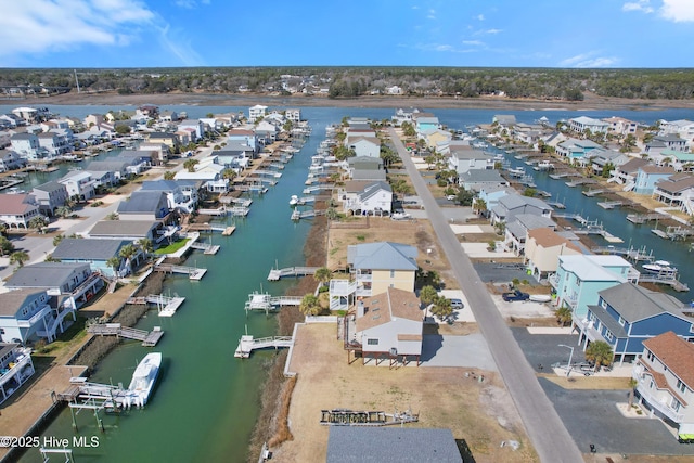 aerial view with a residential view and a water view