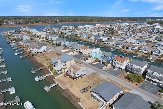 bird's eye view featuring a residential view and a water view