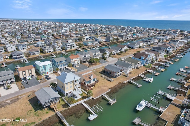 birds eye view of property with a residential view and a water view