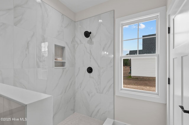 full bathroom featuring tiled shower