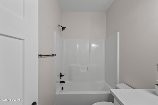 full bath featuring toilet, vanity, and shower / bathtub combination