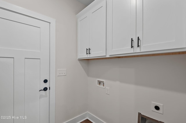 laundry area featuring washer hookup, cabinet space, baseboards, and electric dryer hookup