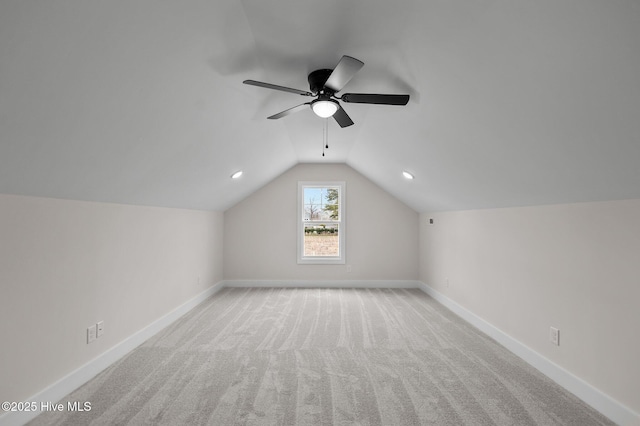 additional living space with baseboards, carpet floors, lofted ceiling, and a ceiling fan