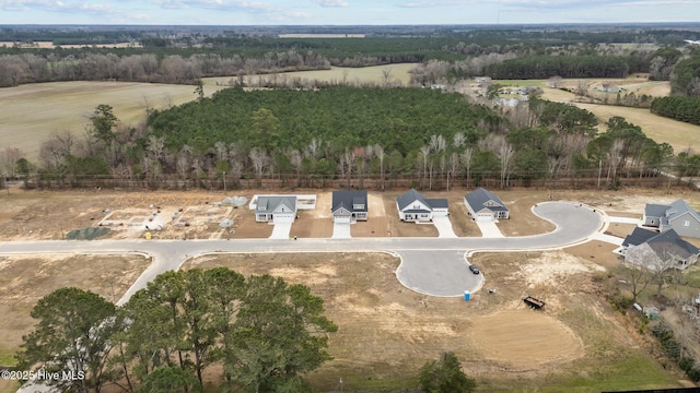 birds eye view of property with a rural view