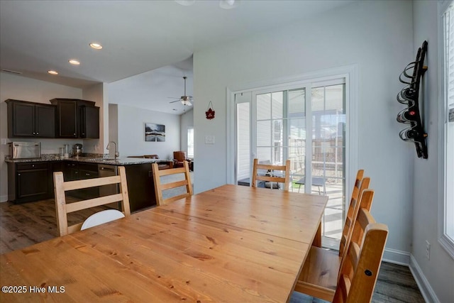 dining room with dark wood finished floors, recessed lighting, a ceiling fan, and baseboards