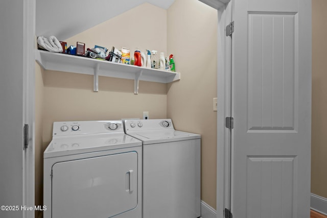 washroom featuring laundry area and washer and clothes dryer