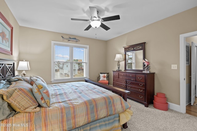 bedroom featuring carpet, baseboards, and ceiling fan