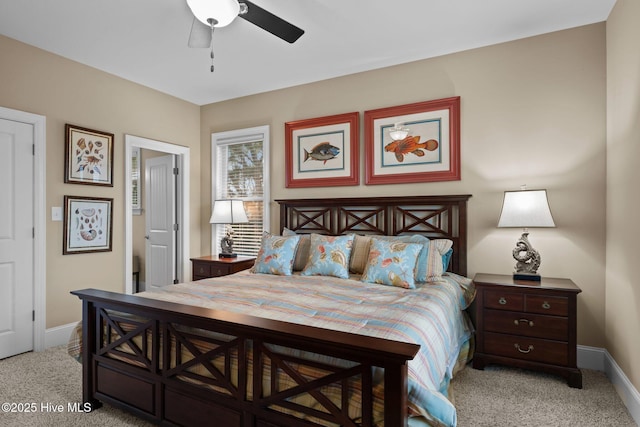 bedroom featuring light carpet, a ceiling fan, and baseboards