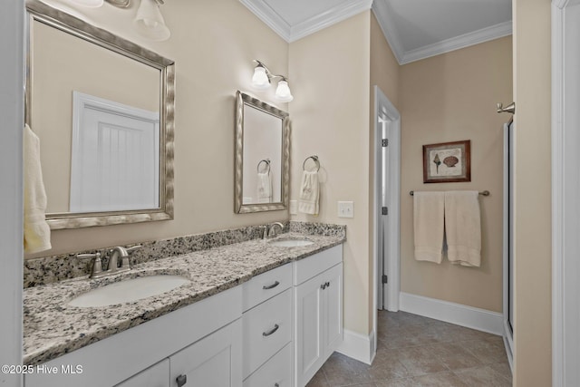 bathroom featuring double vanity, ornamental molding, baseboards, and a sink