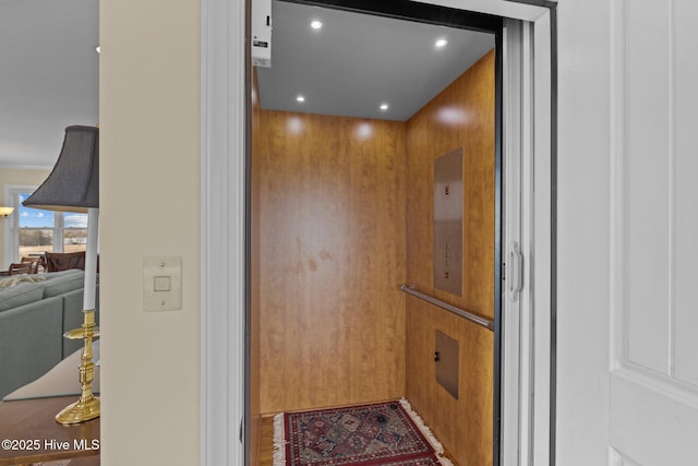 room details with recessed lighting and elevator