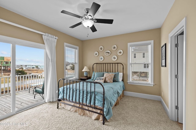 bedroom featuring access to exterior, carpet flooring, a ceiling fan, and baseboards