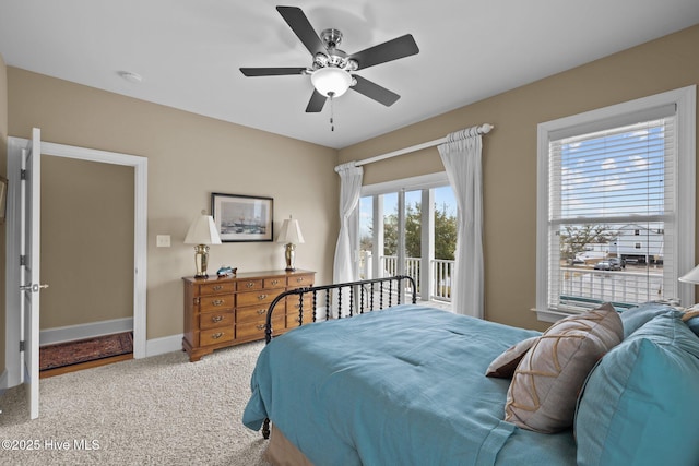 bedroom with access to exterior, ceiling fan, baseboards, and carpet