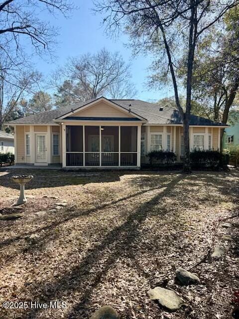 view of front of home with a sunroom