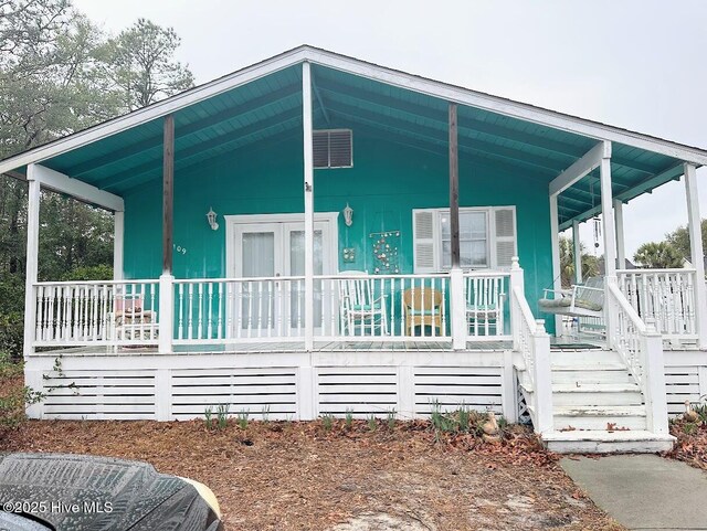 exterior space featuring french doors and a porch