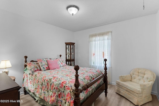 109 NE 17th St, Oak Island, NC 28465 - bedroom with wood finished floors and baseboards