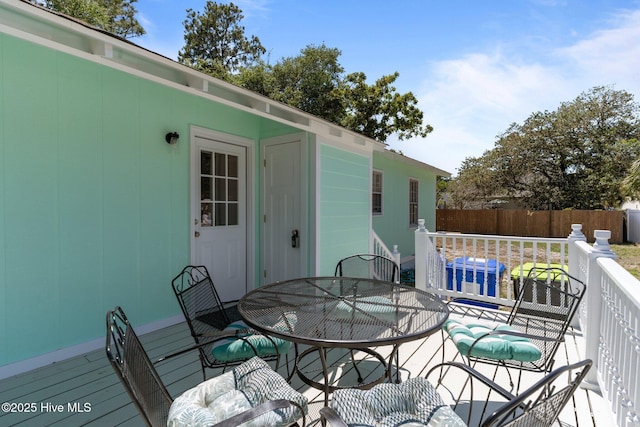 109 NE 17th St, Oak Island, NC 28465 - deck with outdoor dining space