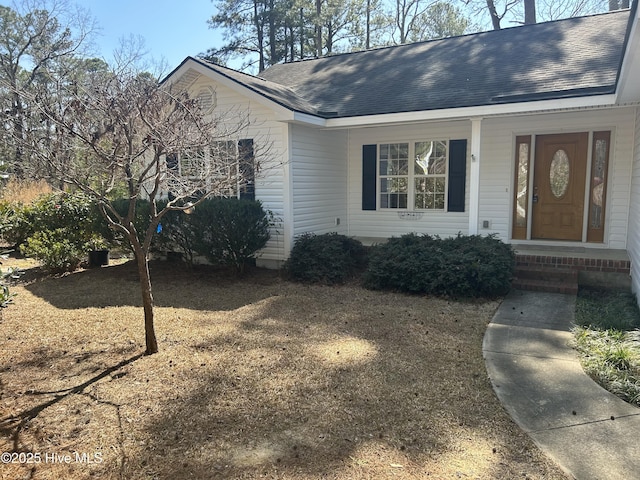 view of front of house with roof with shingles