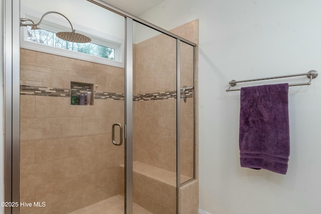 full bath featuring a shower stall