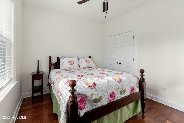 bedroom featuring ceiling fan, a closet, baseboards, and wood finished floors