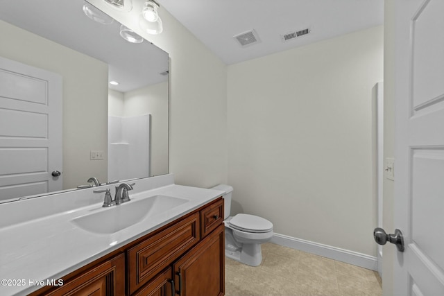 bathroom featuring vanity, toilet, baseboards, and visible vents