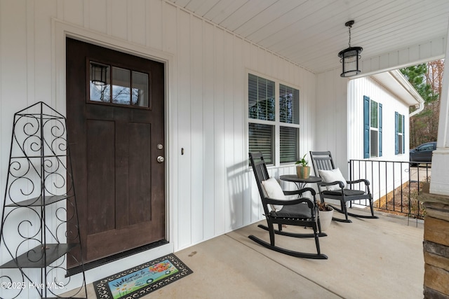 doorway to property featuring covered porch