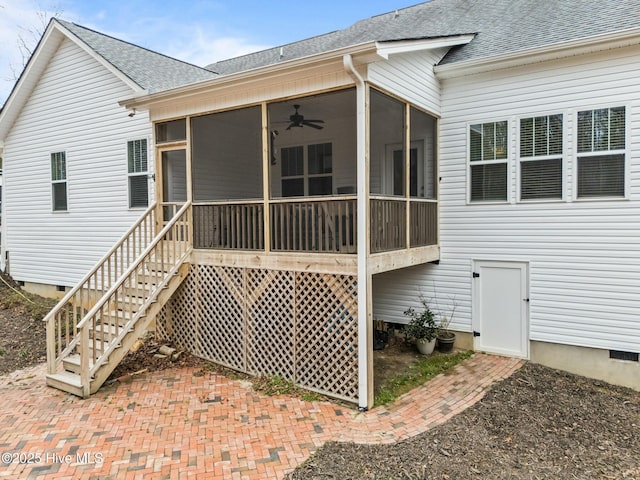 back of property with crawl space, a shingled roof, stairs, and a sunroom