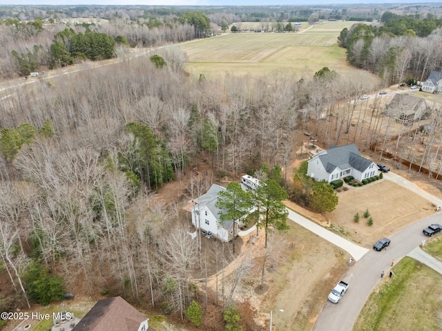 birds eye view of property featuring a rural view