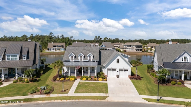 5151 Creswell Dr, Leland, NC 28451 - view of front facade with a porch, a residential view, concrete driveway, and a water view