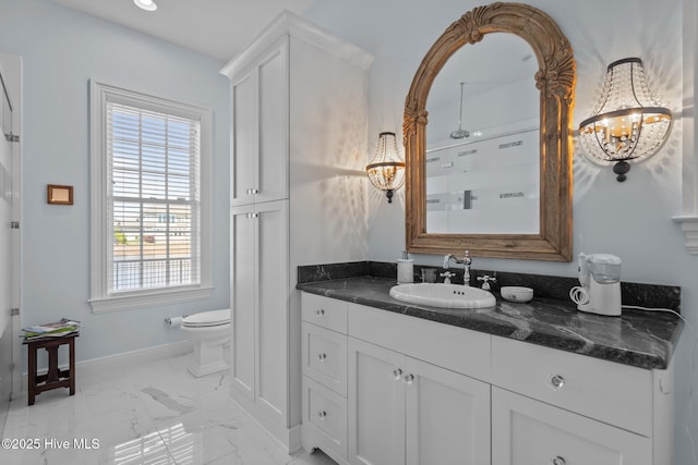 5151 Creswell Dr, Leland, NC 28451 - full bath featuring toilet, marble finish flooring, vanity, a chandelier, and baseboards