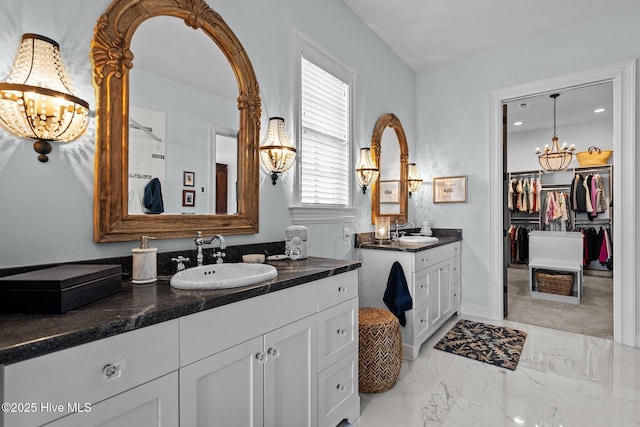 5151 Creswell Dr, Leland, NC 28451 - full bath featuring a chandelier, two vanities, marble finish flooring, and a walk in closet