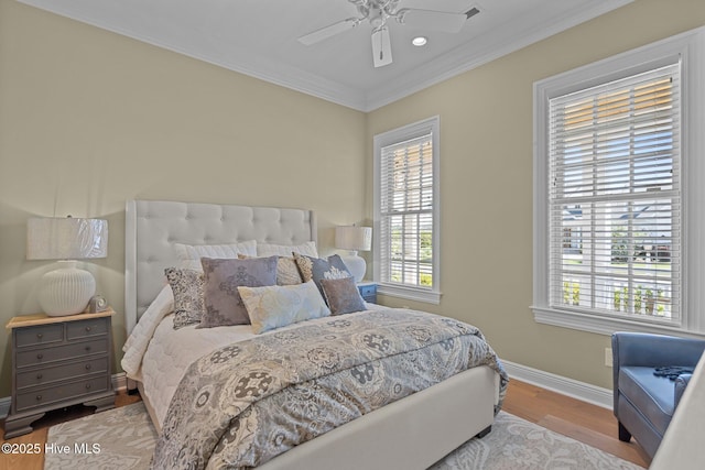 5151 Creswell Dr, Leland, NC 28451 - bedroom with multiple windows, baseboards, wood finished floors, crown molding, and ceiling fan