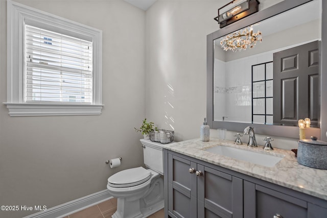 5151 Creswell Dr, Leland, NC 28451 - bathroom featuring vanity, toilet, baseboards, tile patterned flooring, and a chandelier