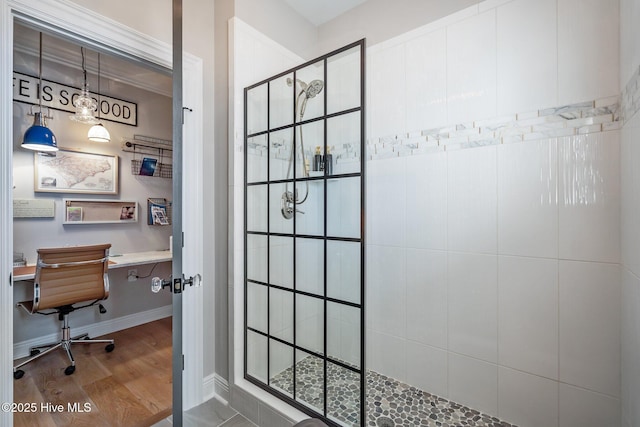 5151 Creswell Dr, Leland, NC 28451 - bathroom with tiled shower, wood finished floors, and baseboards
