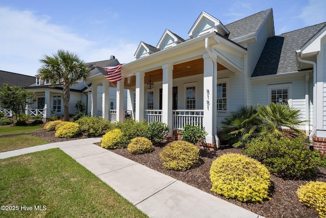 5151 Creswell Dr, Leland, NC 28451 - neoclassical home with covered porch and a shingled roof