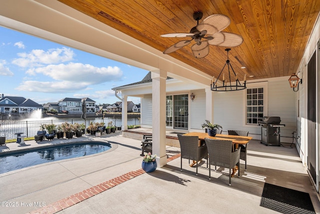 5151 Creswell Dr, Leland, NC 28451 - view of patio / terrace featuring a grill, a water view, a ceiling fan, outdoor dining area, and a residential view