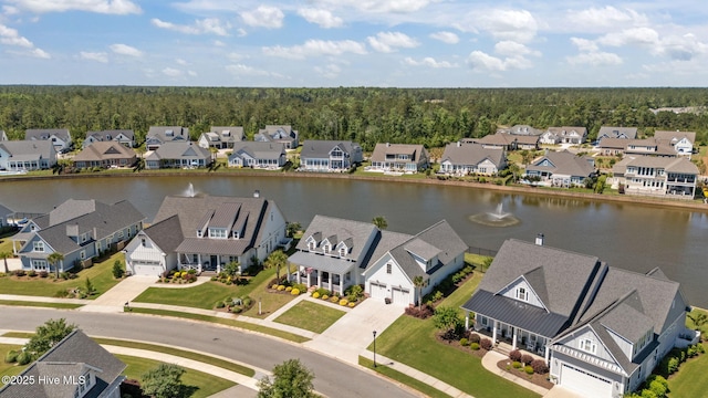 5151 Creswell Dr, Leland, NC 28451 - aerial perspective of suburban area with a nearby body of water and a heavily wooded area