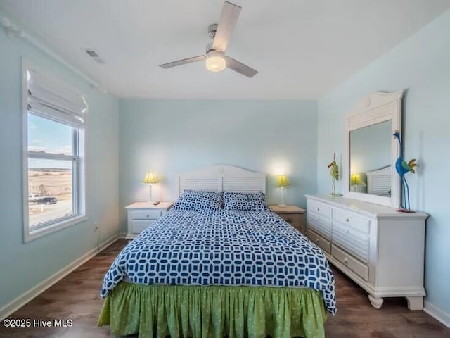 bedroom with visible vents, ceiling fan, dark wood-type flooring, and baseboards