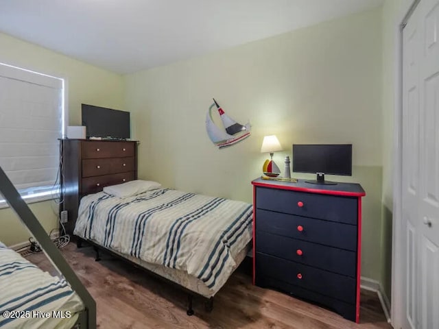 bedroom with wood finished floors