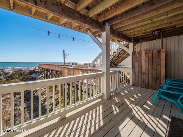 wooden deck featuring a water view