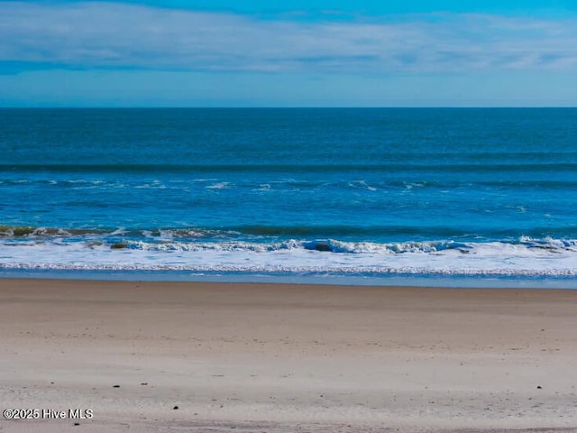 property view of water featuring a beach view