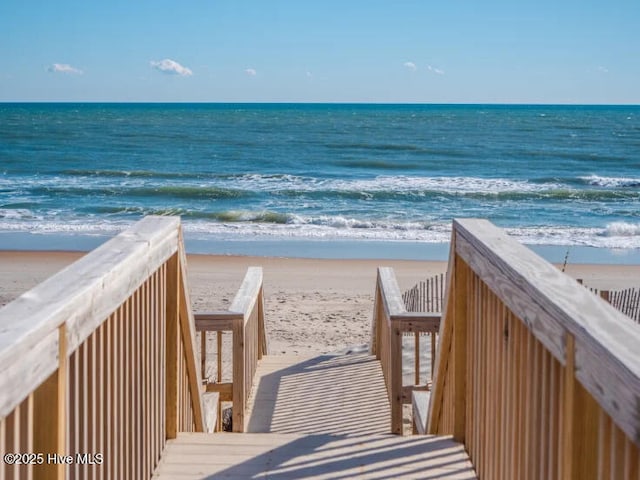 view of home's community featuring a view of the beach and a water view