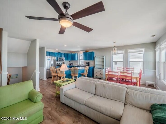 living area featuring recessed lighting, ceiling fan, and wood finished floors