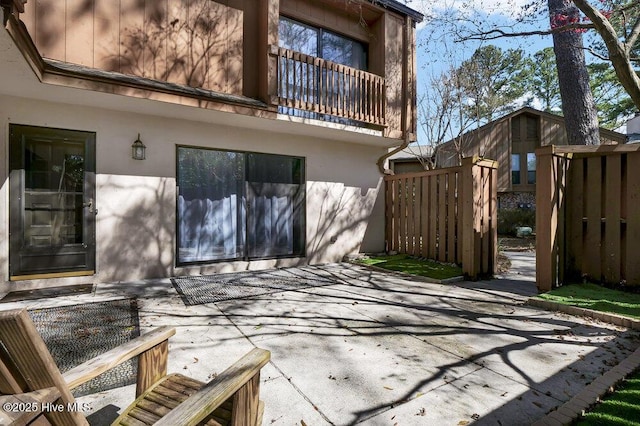 view of patio featuring fence