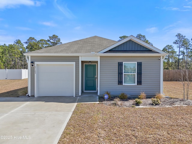 single story home with an attached garage, fence, board and batten siding, and driveway