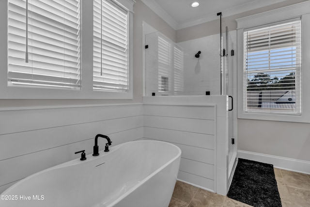 full bath featuring a soaking tub, plenty of natural light, baseboards, and a stall shower