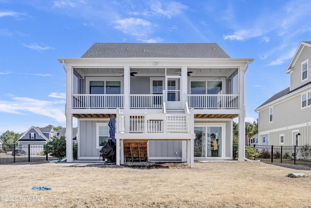 back of property with stairs, a fenced backyard, board and batten siding, and ceiling fan